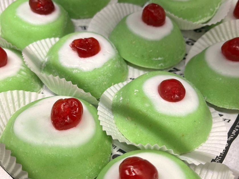 Sicilian cassata — small domes of pale green marzipan, each topped with white icing and a glacé cherry